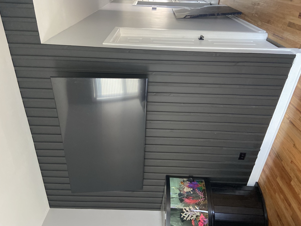 Custom shiplap fireplace wall with mantel by ECV Handyman Services